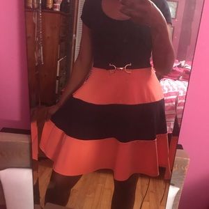 Blue and peach dress with gold piece in middle.